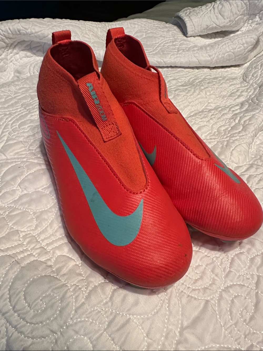 Nike Kids Red Soccer Cleats with Teal Swoosh